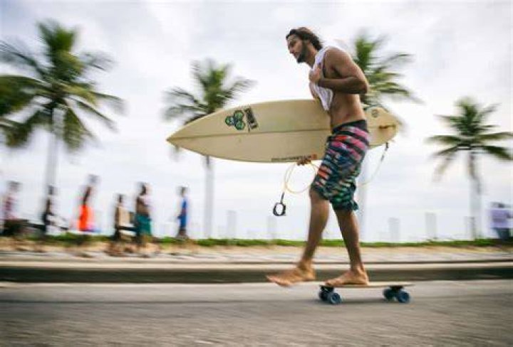Why do surfers wear board shorts?